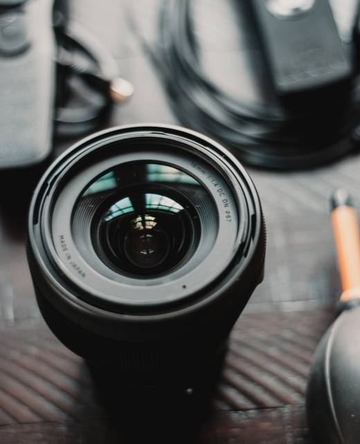 Photo by whereslugo black camera lens on brown wooden table